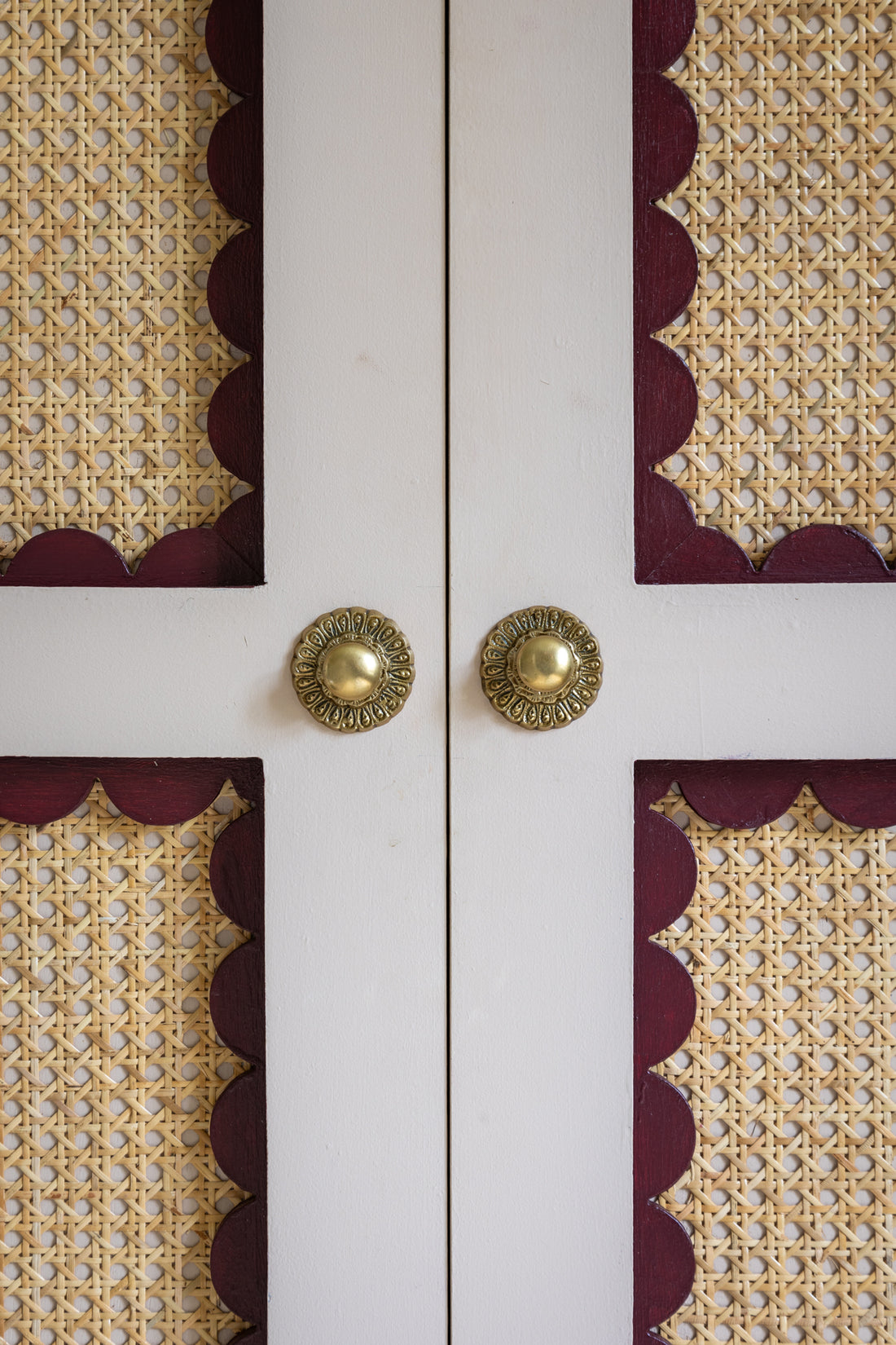 Beautiful inlaid Louli scalloped architrave. used as a detail within the joinery of this rattan and scalloped cupboard or wardrobe. Painted in Edward Bulmer Jonquil and Pompadour